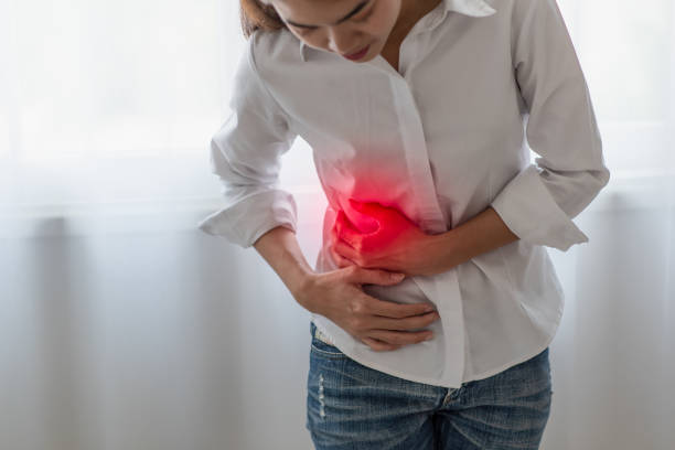 8 Unhealthy asian woman hands touching her belly, Looking like stomach pain, Healthcare concept
