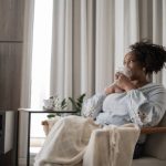 Mature woman using an inhalation mask at home Mature woman using an inhalation mask at home